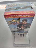Front view of sealed 2021-22 Upper Deck Hockey Series One blaster box with hockey player image and logo.