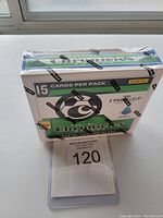 Front view of the sealed mini box showing branding, card count, and product details