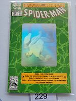 Front cover of Spider-man #26 with holo Spider-man image and promotional text.