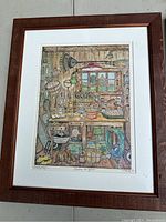 Framed detailed print showing various garden shed tools and items with visible artist signature and edition notes.