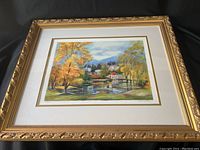 Front view of framed serigraph showing full print and decorative gold-tone frame