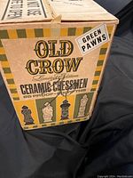 Outer cardboard box of Old Crow Limited Edition Ceramic Chessmen decanters with vintage label and chess piece artwork
