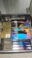 Photo showing 007 VHS box set and several empty recordable VHS tapes from Memorex and Sony inside a crate.