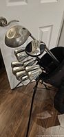 Two Callaway Big Bertha drivers and Ben Hogan irons in Wilson stand bag