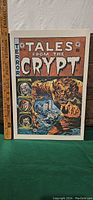 Large format 'Tales From The Crypt' print showing detailed horror comic cover art with ruler for size reference.