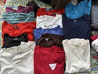 Multiple 3XL women's shirts showing variety in colors and styles