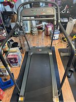 Front view of Sunny SF-T7857 treadmill showing handrails and console