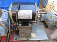 Overview of Emerson motor on stainless steel base, showing side profile and mounted position.