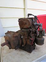 Front perspective showing visible rust, motor casing, and protruding shaft.