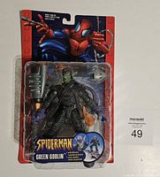 Full view of sealed Marvel Spider-Man Green Goblin 6-inch action figure in original packaging with Spider-Man artwork on the card.