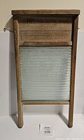 Full front view of vintage Fraser Mountain washboard showing texture and construction materials.
