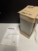 IKEA GRÖNÖ lamp with the box and instruction manual showing the product and branding.