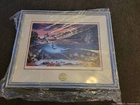 Framed Lenox picture of an underwater scene with dolphins and coral, sealed in original plastic wrapping.