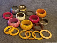 Top-down view showing all bracelets arranged on cloth surface for overall lot display.