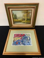 Two framed paintings photographed together against a black backdrop showing the full works and frames