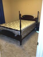 Angled front view of full assembled bed frame and mattress