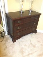 Front view of dresser showing three drawer fronts and hardware
