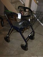 Side angle showing structure, seat, and basket attachment of the mobility cart.