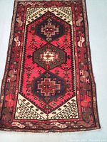 Full top view of the Persian Malayer rug laid flat showing overall design, color, and condition.