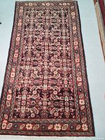 Full view of the hand-knotted Persian Malayer wool rug laid flat to show pattern, color, and condition.