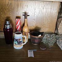 Full lot assortment on wood surface with stone wall background