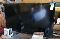 Front view of the Sanyo DP55D33 TV showing the full 55-inch screen and black frame.