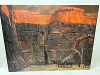 Full view of the painting showing the western landscape and cowboys with horses in front of rocky cliffs.