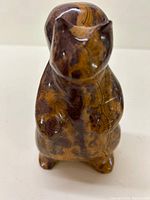 Front view of polished marble squirrel figure standing upright