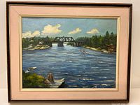 Front view of the framed oil painting showing lake, bridge, boats and surrounding landscape.
