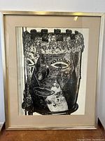 Close-up front view of framed black and white abstract impressionist photograph.