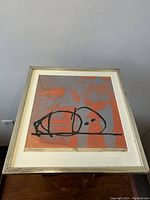 Framed limited edition silk screen print showing full artwork with visible signatures and edition number.