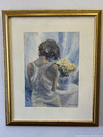 Full frontal view of framed acrylic painting depicting woman seated with back turned, next to vase of flowers.