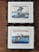 Both woodcut prints shown in their bamboo style frames on a wooden table