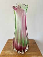 Front view of the mid century Italian Murano art glass vase showing color gradient from green at top to pink and blush at bottom, clear glass scalloped rim and flower petal shaped base.