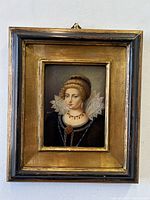 Front view of framed enamel painting