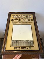 Front view showing the entire framed mirror with the ‘Wanted Dead Or Alive’ poster design and inset mirror section.