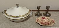 Photo of all items: Nyott Son & Co covered vegetable dish, Masons Watteau dish, and 2 silver plate candle holders on a neutral fabric surface