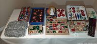 Wide view of assorted ornaments and tinsel laid out on table