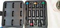 Five Pro.Point impact torque extensions in a black plastic case with color-coded ends.