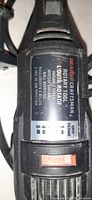 Close-up of the label on the Sears Craftsman rotary tool showing variable speed and specifications.