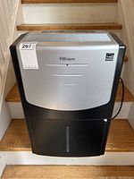 Front view of the Danny Premiere dehumidifier showing the badge, water tank window and top vents.