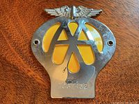 Close-up front view emphasizing chrome finish, enamel and mounting holes