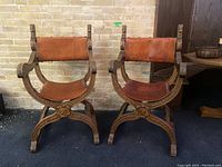 Front view of both chairs against brick wall