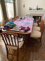 Eight chairs arranged around dining table in room