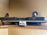 Side view photo of dolly on its wheels showing structure and wheels.