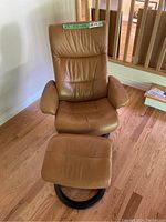 Front view showing chair seat, back and ottoman