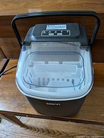 Top view of Silvano portable ice maker showing control panel and transparent lid