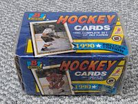 Front and top view of the sealed 1990 Bowman hockey card box showing player images and set details