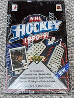Front view of sealed 1990-91 Upper Deck NHL hockey box showing player card and branding