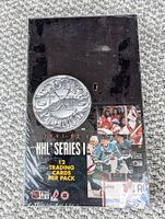 Front of sealed black 1991-92 Pro Set Platinum NHL Series I box with silver logo and player images
